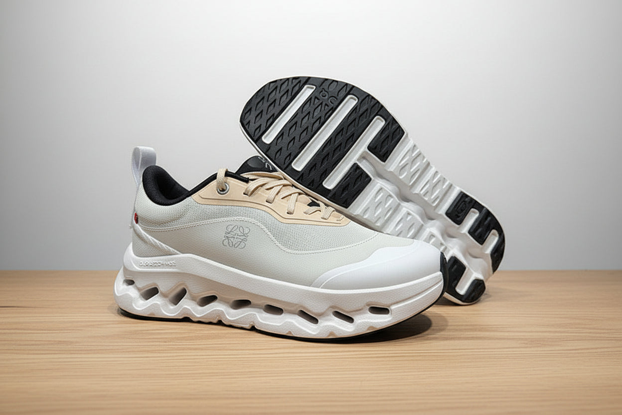 White and beige athletic shoes on a gray surface with a black background