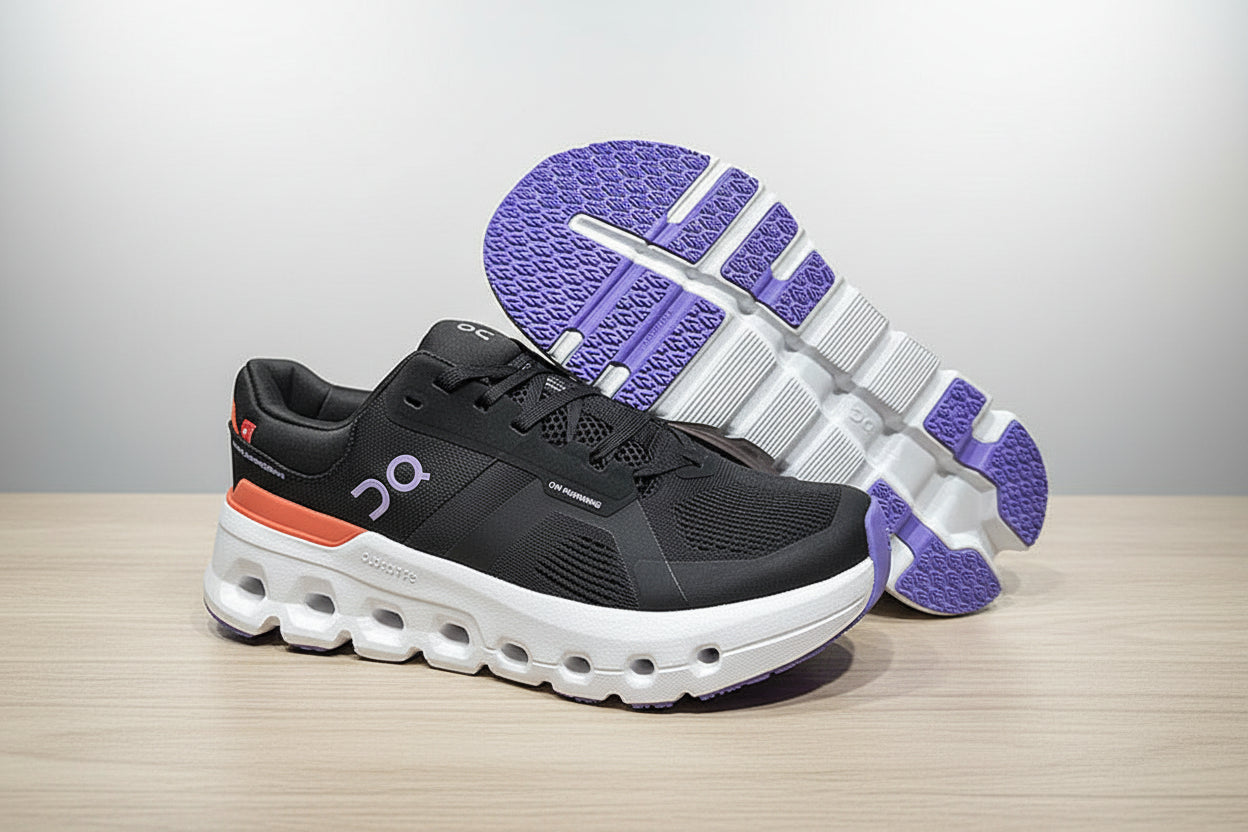 Black running shoe with purple sole on a gray surface