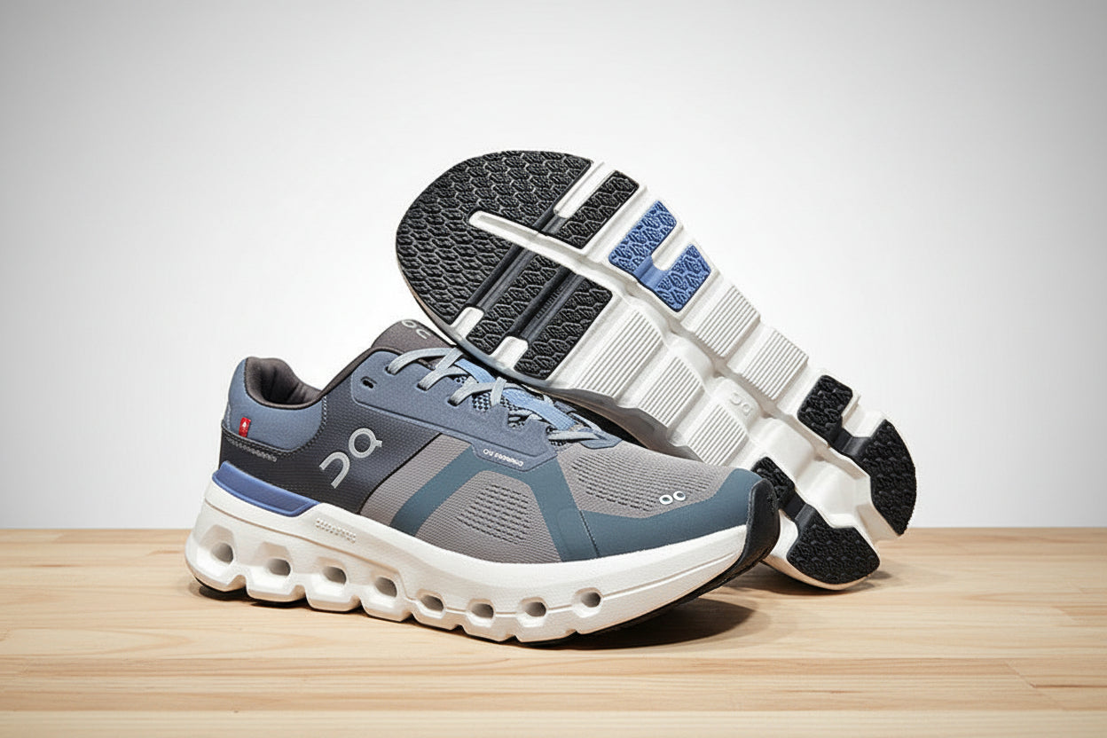 Gray and blue athletic shoes on a gray surface with a black background